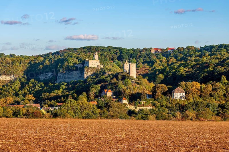 View over a ploughed field of Rudelsburg and Saaleck castle ruins in autumn, Saaletal near Bad Kösen, Naumburg, Saxony-Anhalt, Germany