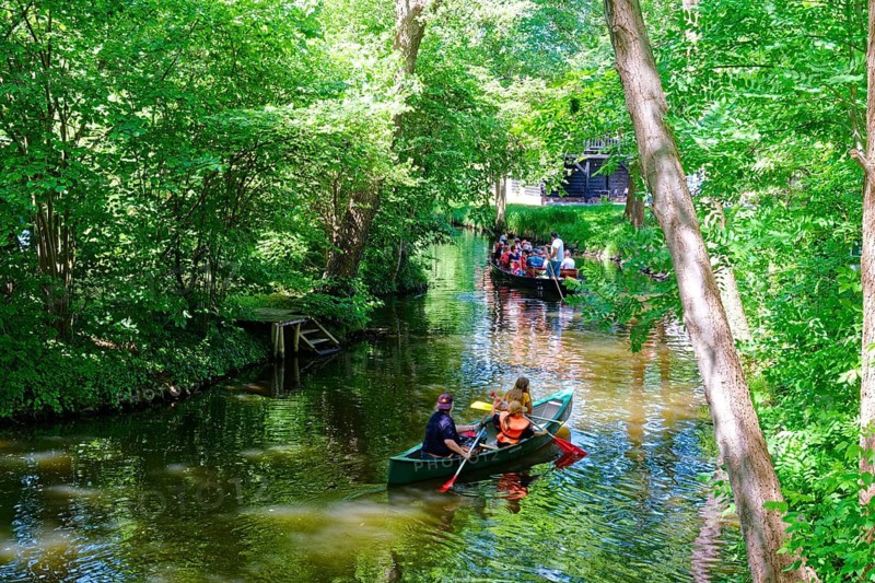 Tourists in boats or canoes on the main river Spree in the Spreewald, UNESCO Spreewald Biosphere Reserve. Castle, Brandenburg, Germany