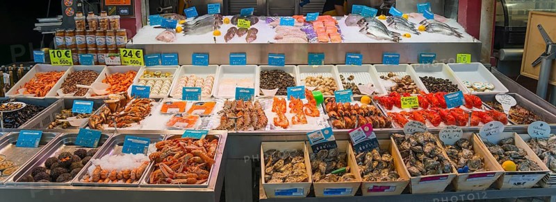 Rich offer of seafood and fish on a market stall, carefully placed on ice, fish market, Trouville-sur-Mer, Trouville, Normandy, France