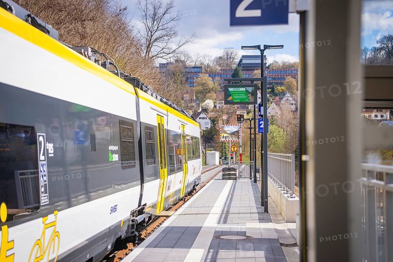 Urban environment with modern train on a track under cloudy sky, Hermann Hesse Bahn, ZOB, Calw, Germany