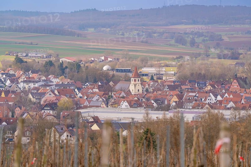 Panorama of a rural area with a church and red roofs under a cloudy sky, Großbottwar, Ludwigsburg district, Baden-Württemberg, Germany