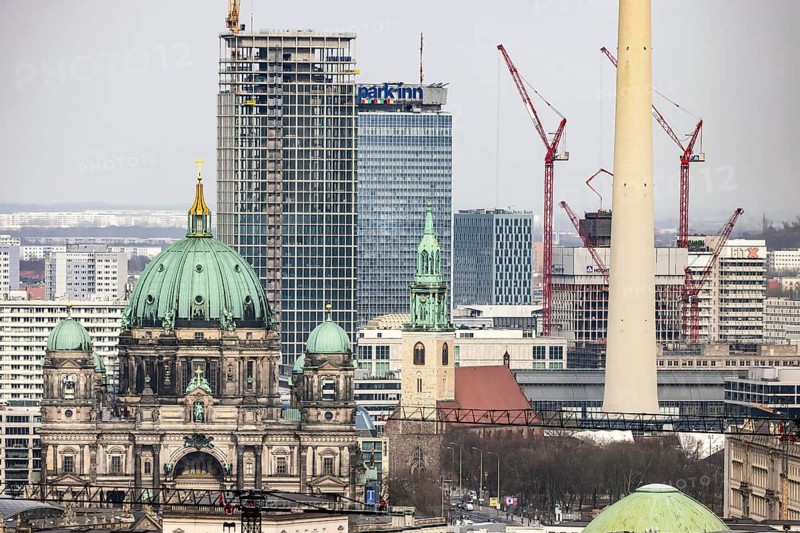 City view of Berlin. View of the capital from the observation deck in K o l l h o f f t o w e r. View of Alexanderplatz in Berlin. Berlin Cathedral. Covivio-Tower construction site and The Berlinian. When completed, the tower should be 146 meters high. Berlin, Germany