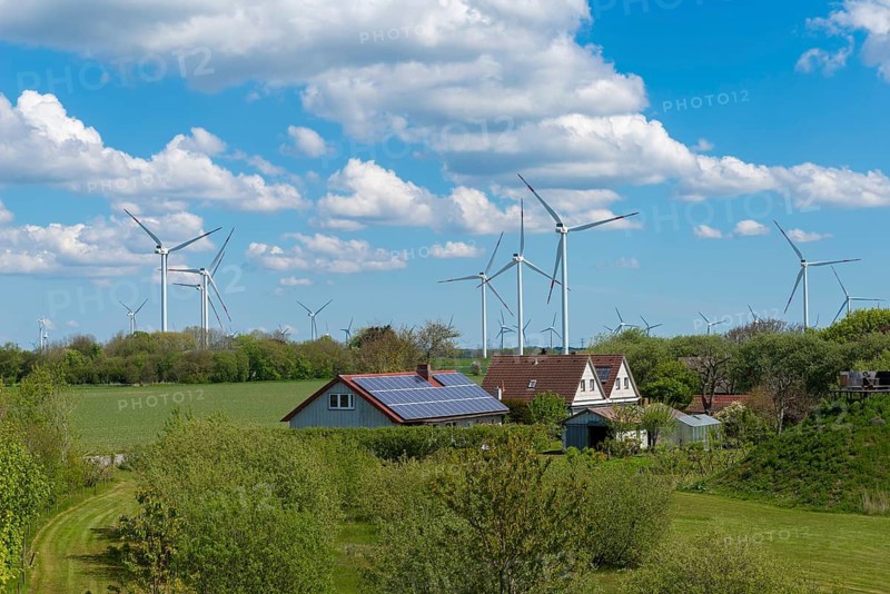 Solar energy and wind turbines in the Reußenköge community wind farm, North Frisia, clean energy, power generation, economy, technology, solar system, house roof, sun, agriculture, spring, blue sky, west coast of Schleswig-Holstein, Germany