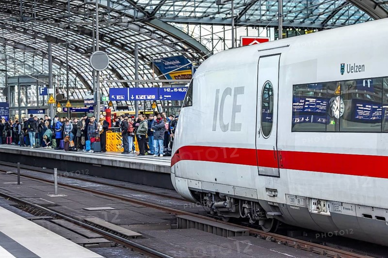 Berlin Central Station. Travelers on the platform. Incoming ICE. Berlin, Germany