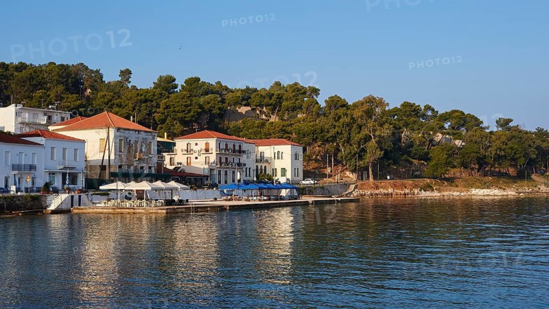 Coastal houses with trees and peaceful vibes under a clear blue sky, Navarino Bay, Pylos, Peloponnese, Greece