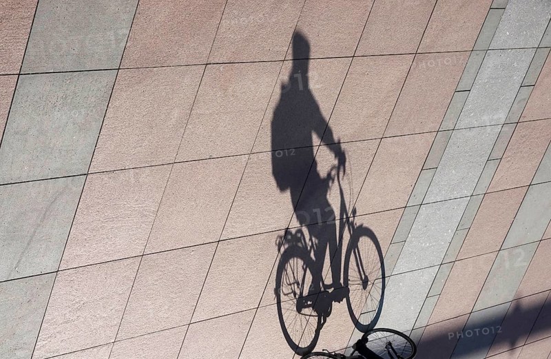 Cyclist with shadow, Winter, Saxony, Germany