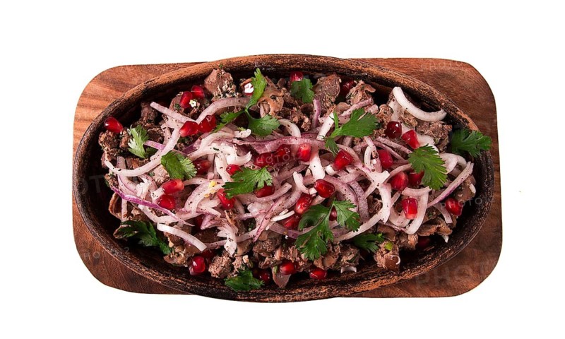 Kuchmachi, a traditional Georgian dish, in a clay Ketsi plate, close-up