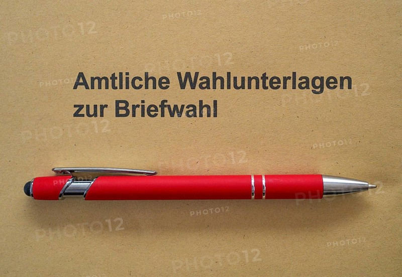 Red ballpoint pen is on envelope, postal ballot, official absentee ballot documents, election, parliamentary election 2026, Stuttgart, Baden-Württemberg, Germany