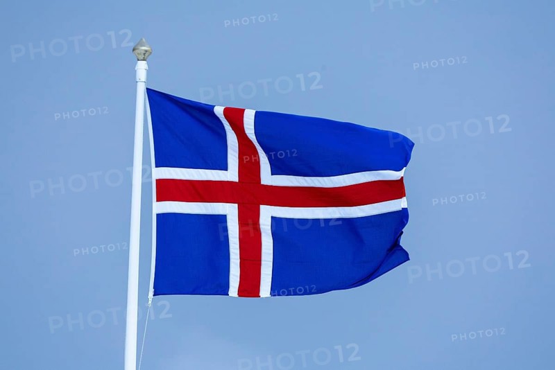 Iceland flag flying on mast, Iceland, Scandinavia