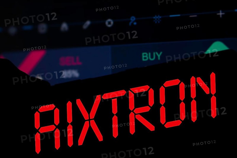 AIXTRON logo is displayed on smartphone. Aixtron SE is a European multinational technology company.
