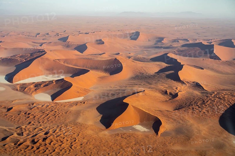 Aerial view of salt pans and red sand dunes of the Namib Desert, Namib Naukluft Park, Namibia