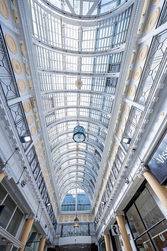 View of the architectural glass roof of a passage with lights and elegant structures, Dublin, Ireland