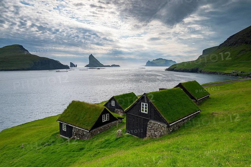 Traditional houses in the village of Bøur, Tindhólmur and Drangarnir, Vágar Island, Faroe Islands, Denmark