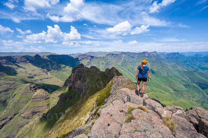 Female mountaineer at the summit of Cathedral Peak or Cathedralpiek or Mponjwana, Drakensberg, KwaZulu-Natal, South Africa