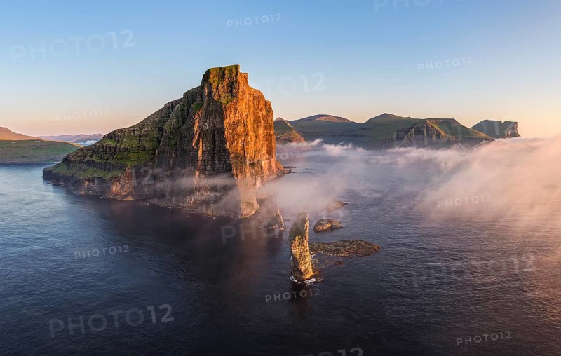 The Risin og Kellingin pinnacles off the Eysturoy cliffs in the evening light, Faroe Islands, Denmark