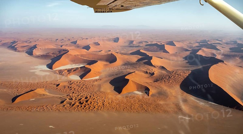 Aerial view from the plane, red sand dunes of the Namib Desert, Namib Naukluft Park, Namibia