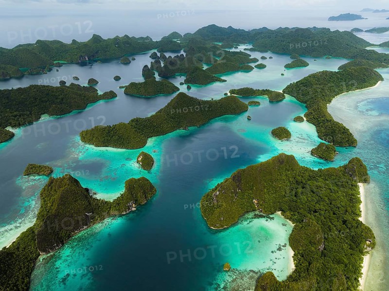 Aerial view of tropical islands and turquoise lagoons, Wayag Archipelagio, West Papua, Indonesia