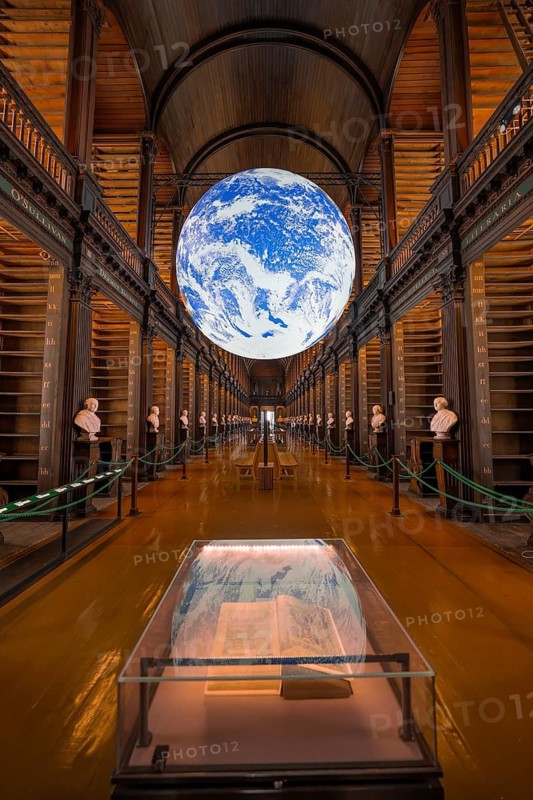 Impressive library with lively globe display and old books, Trinity Collage, Dublin, Ireland