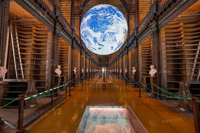 Impressive library with illuminated globe and classic busts, Trinity Collage, Dublin, Ireland