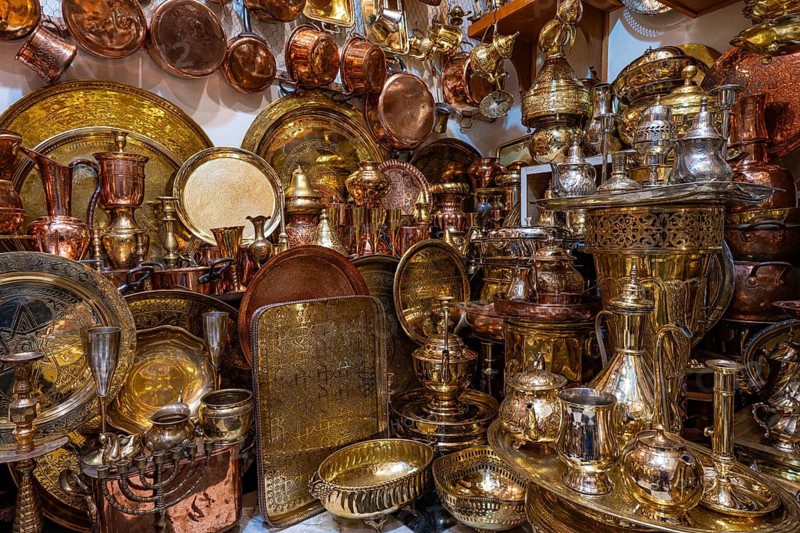 Brass and copper vessels, plates and trays displayed for sale in a shop, Souk, Bazaar, Maghreb, Marrakech, Morocco, North Africa