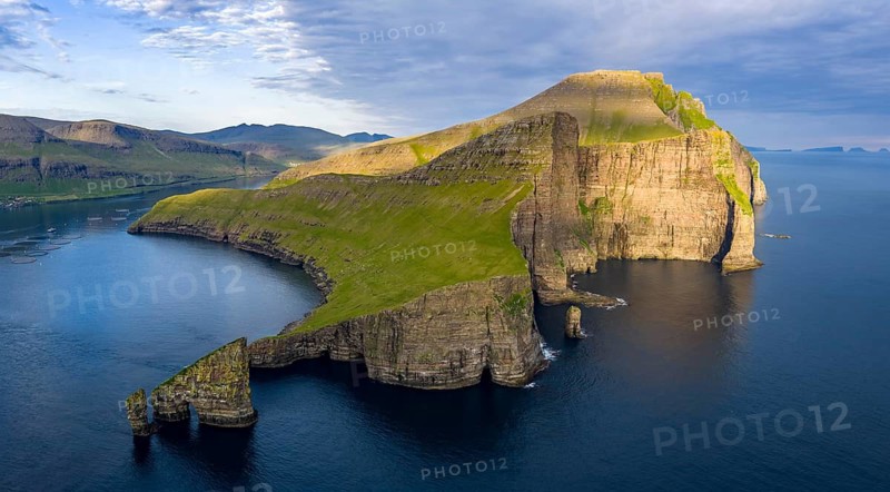 Drangarnir rock formation on the steep coast of the island of Vágar, Faroe Islands, Denmark