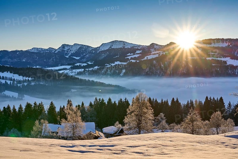 Moodx sunrise over the mountains of the Nagelfluh mountain chain in the Allgaeu Alps with Hochgrat summit, Oberstaufen, Bavaria, Germany