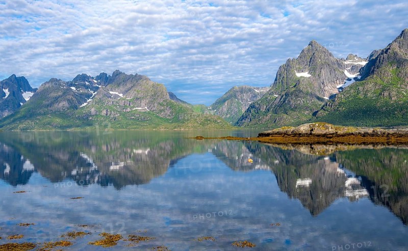 Picturesque fjord landscape at Raftsund fjord, mountains reflected in water, Vesterålen, Norway