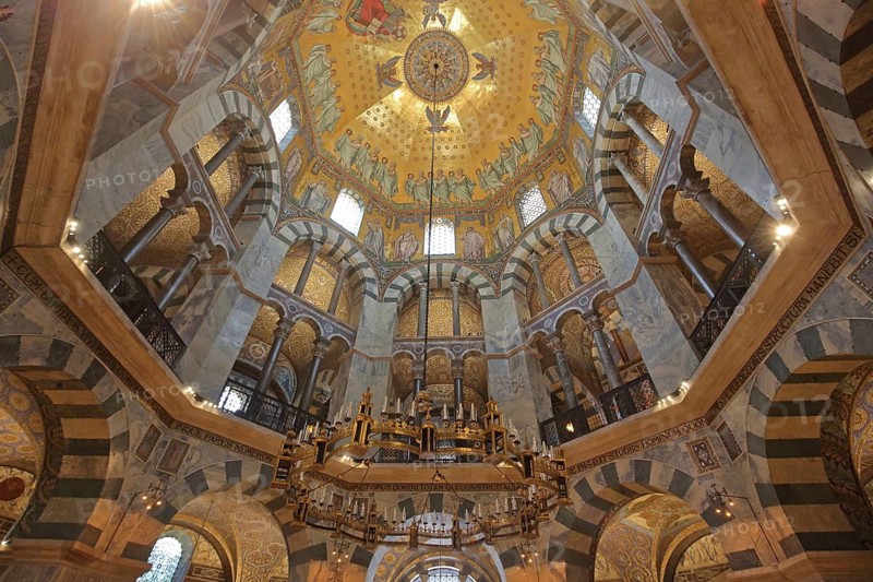 Interior view of octagon with seating and chandelier, vaulted ceiling, handicrafts, ornaments, wall mosaic, decorations, UNESCO Aachen Cathedral, St. Marien Cathedral, Old Town, Aachen, Eifel, North Rhine-Westphalia, Germany