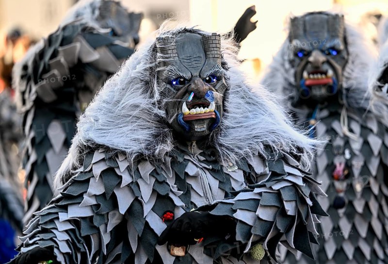 Members of a fools' guild in traditional Haes, fools' clothes, during the carnival procession in Achern, Ortenaukreis, Baden-Württemberg, Germany