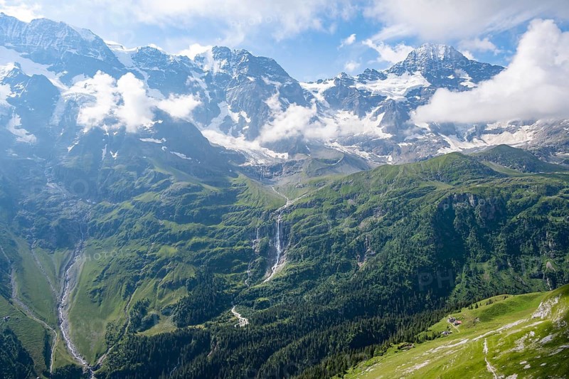 Schmadribachfall waterfall and picturesque mountain landscape with Breithorn mountain peak, Bernese Alps, Bernese Oberland, Switzerland