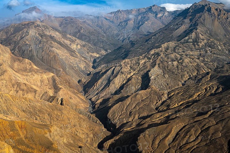 Mountain landscape in evening light, erosion landscape, river valley near Tangge, Mustang, Upper Mustang, former kingdom, Himalayas, Nepal