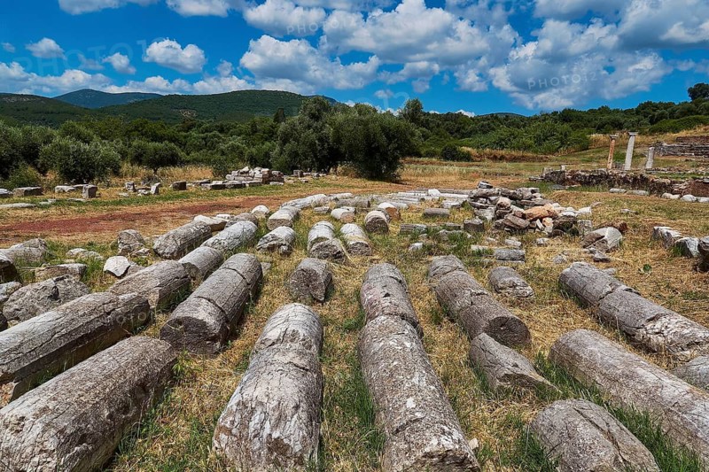 Ancient debris and stones spread out in a meadow under a blue sky, ancient site, archaeological site, Messene, Messini, Messinia, southwest of the Peloponnese, odyssey, Odyssey, Odysseus, Ulysses, film, filming location, Matt Damon, Peloponnese, peninsula, Greece