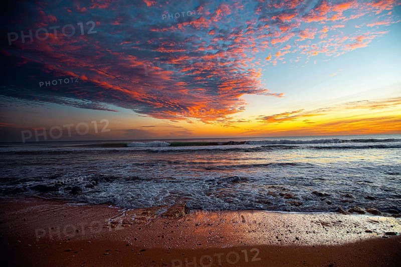 Colourful sky over the beach at sunset, with lively waves and rocks, sunset, Praia do Amado, Carrapateira, Algarve, West Coast, Atlantic, Portugal