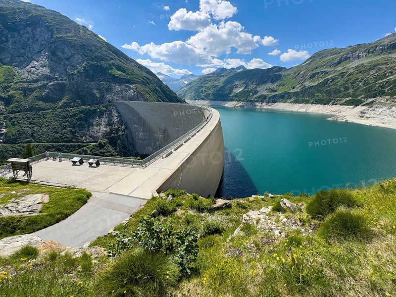View from an elevated location at the 200-meter high Kölnbrein dam highest dam in Austria, 1933 meters above sea level. Side facing away from the water on the left air side, Kölnbreinspeicher reservoir with reservoir, Malta Valley, Carinthia, Austria