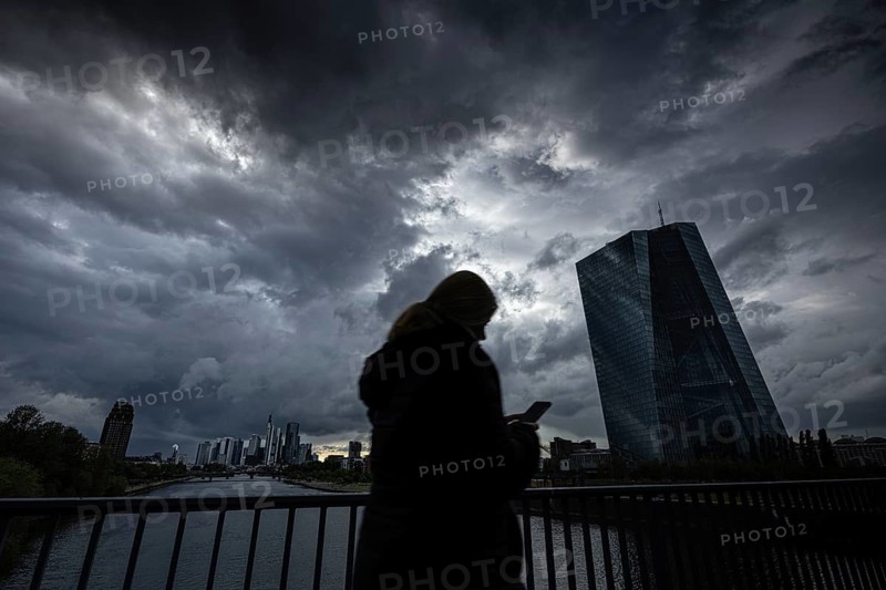 Dark rain clouds in the sky over the European Central Bank (ECB) in Frankfurt am Main, Frankfurt am Main, Hesse, Germany