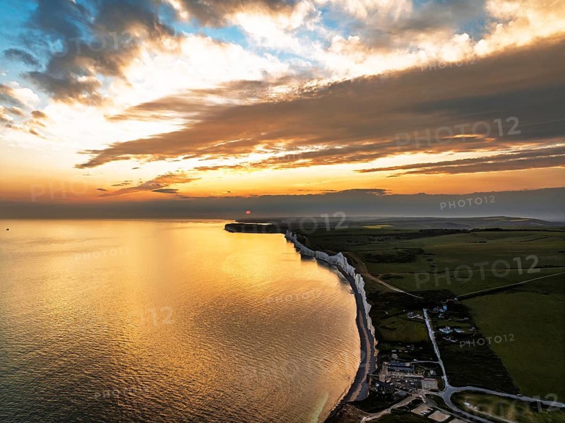 Sunset over Seven Sisters Cliffs from a drone, English Channel, East Sussex, South-east England