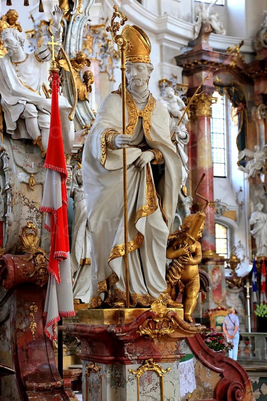 One of the emergency workers at the Altar of Mercy in the Vierzehnheiligen Basilica, Bad Staffelstein, Lichtenfels district, Upper Franconia, Bavaria, Germany. The church, built according to plans by Balthasar Neumann, is dedicated to the fourteen emergency workers