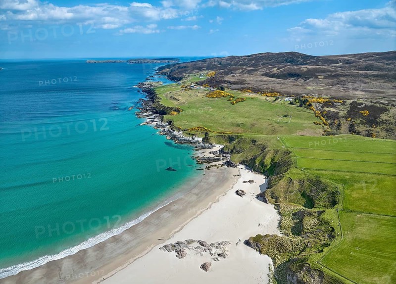 Aerial photo of a bay with golden sand beach at the scottish atlantic coast near Coldbackie, Scotland, UK