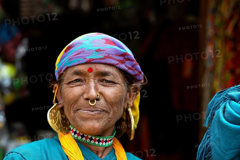 Portrait, friendly smiling elderly Nepalese woman with traditional jewelry and bindi, Hindu ethnic group, Simikot, Humla, Himalayas, western Nepal, Nepal