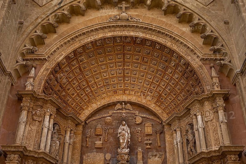 Palma Cathedral, also known as La Seu, is Palma's landmark and is one of the most important Gothic buildings in Europe. It was built from 1229 on the remains of a former mosque and impresses with its huge rose window and its location right by the sea. In the 20th century, Antoni Gaudí redesigned parts of the interior and gave the cathedral additional architectural accents, Palma, Majorca
