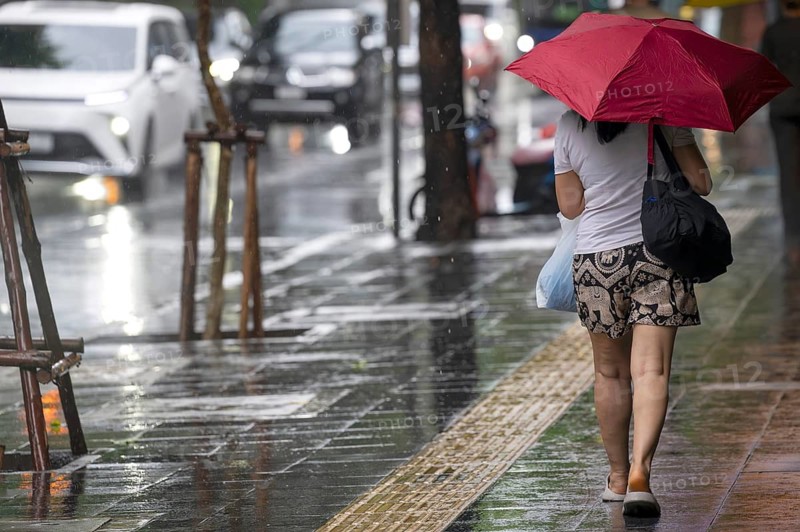 Woman with umbrella, Bangkok, Thailand