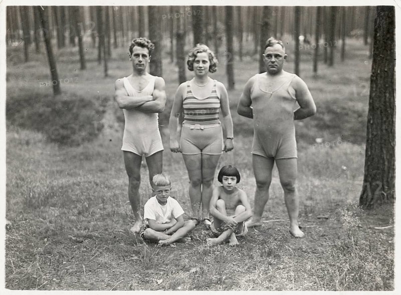 Bathing, swimwear, children, men, woman, forest, A family in bathing suits standing in a clearing in the forest, three adults and two children, June 1930