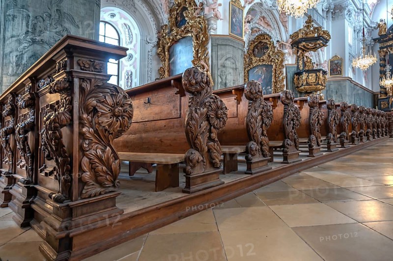 Decoratively carved cheeks of church pews, parish church of the Assumption of Mary, 17th century Baroque architecture, Garsten, Upper Austria