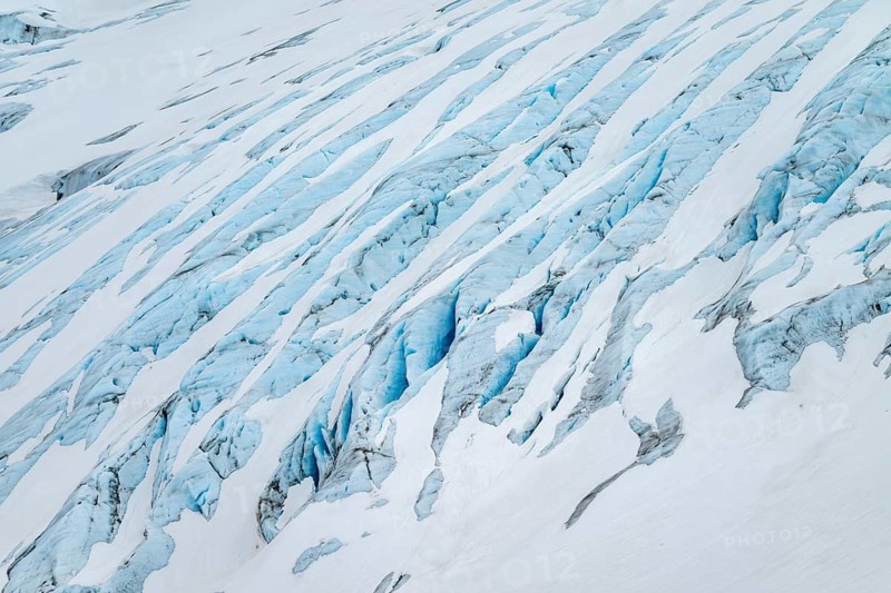 Blue rugged glacier ice with crevasses and snow, detail, Exit Glacier, Kenai Peninsula, Alaska, USA