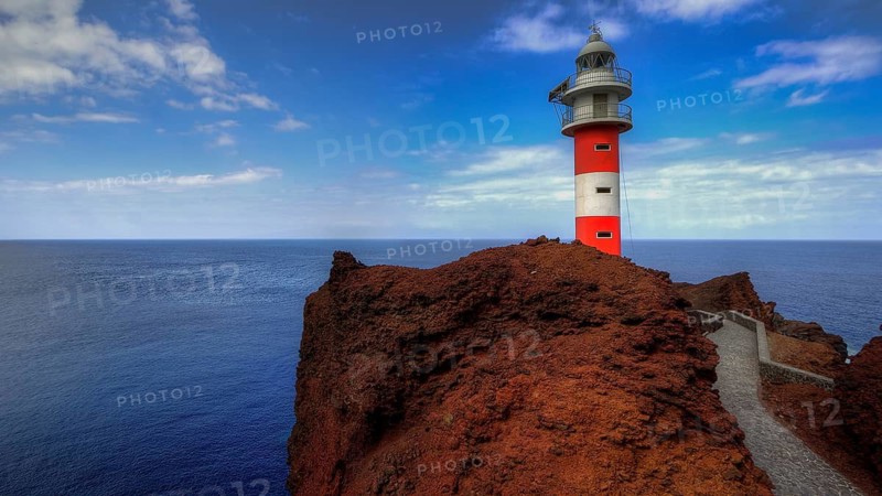 Punta de Teno, red lighthouse on rocky coast surrounded by blue sky and sea, Masca, Barranco de Masca, canyon, Teno, Teno Mountains, northwestern Tenerife, Tenerife, Canary Islands, Spain