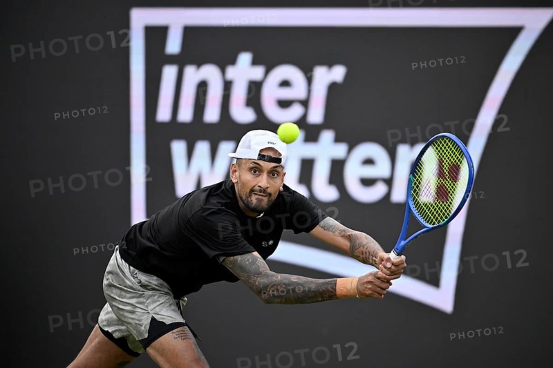 Nick Kyrgios (AUS) in action, with the INTERWETTEN BOSS Open 2026 logo on the backboard, ATP 250 tennis, grass-court tournament, Stuttgart, Baden-Württemberg, Germany