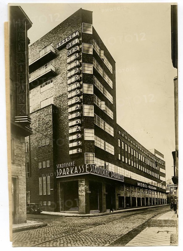 Essen, House of Technology, architecture, Edmund Körner, brick corner building with signs in a retro-style urban street, 1930