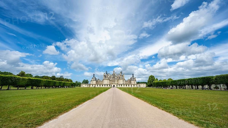 Southeast view, panorama of the monumental Renaissance Château de Chambord castle with its distinctive, richly decorated roof silhouette of numerous towers, chimneys and dormers, Chambord Castle, Blois arrondissement, Loir-et-Cher department, Centre-Val de Loire region, France