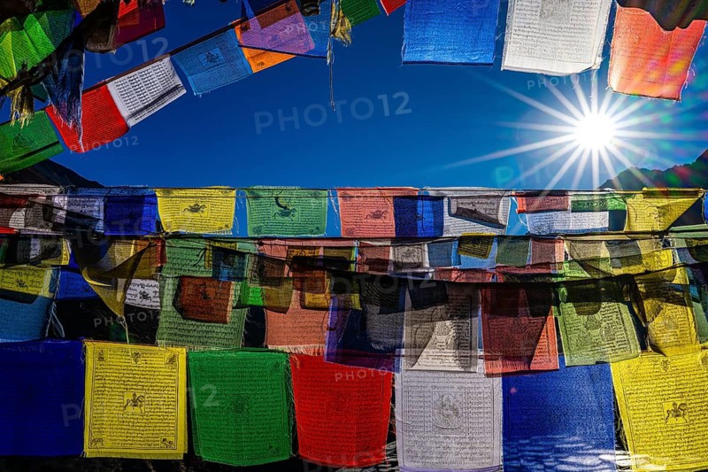 Tibetan Buddhist prayer flags printed with sacred mantras in sunlight, Tsum Valley, Mu Gompa, Himalayas, Nepal