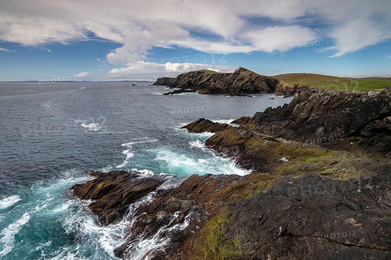 Rocky coastal landscape with surf and cliffs on the Shetland Islands, Mainland, Scotland, Great Britain